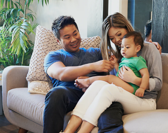 Happy family sitting together on a couch