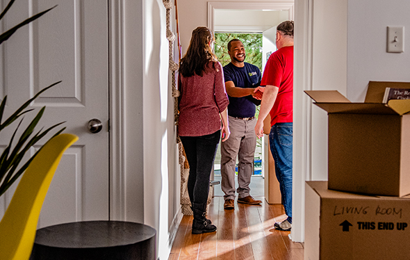 People Greeting each other at door